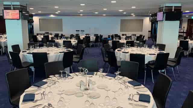 Drake and Harris Suites at Chelsea FC, elegant dinner setup for networking events.