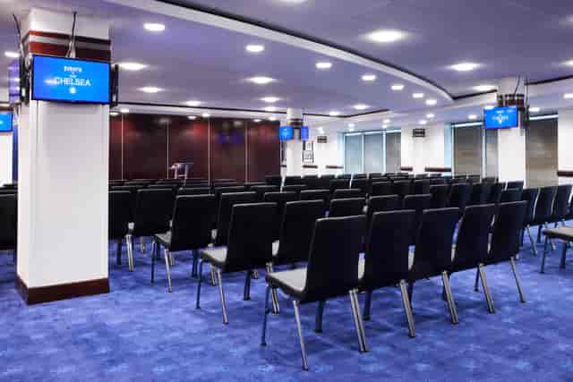 Tambling Suite at Chelsea FC, featuring black chairs for corporate events and conferences.