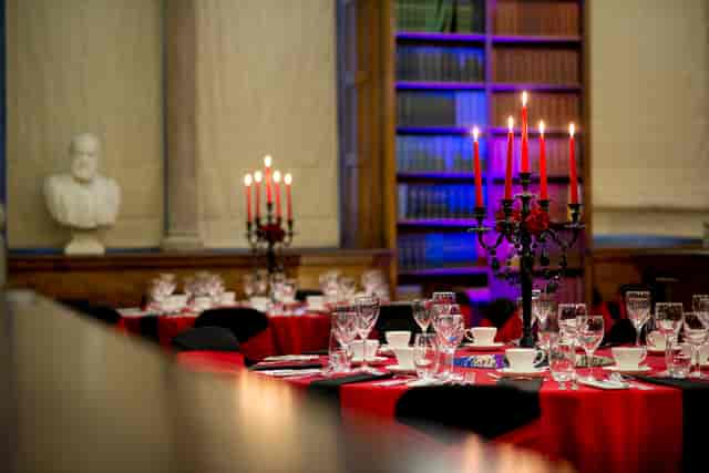 Elegant dining area at Christie's Bistro with red tablecloths for formal events.