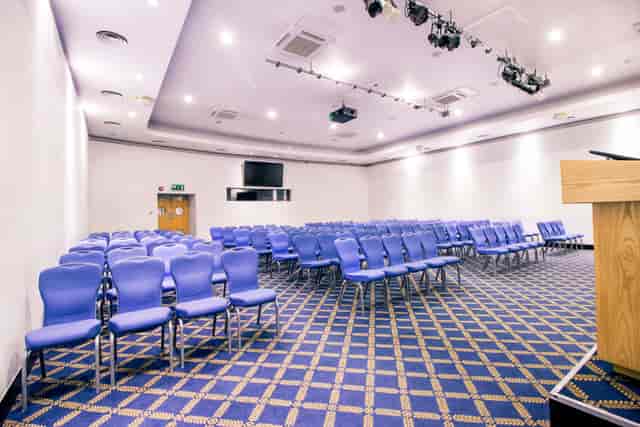 Bill Boeing Room with blue chairs, ready for a conference or seminar event.