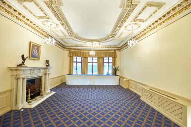 Elegant meeting space with chandeliers at Marshall of Cambridge, perfect for corporate events.
