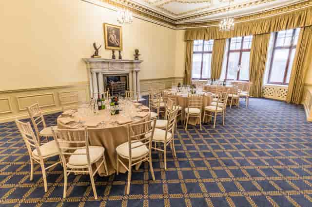 Elegant event space with round tables, ideal for corporate meetings and private dinners.
