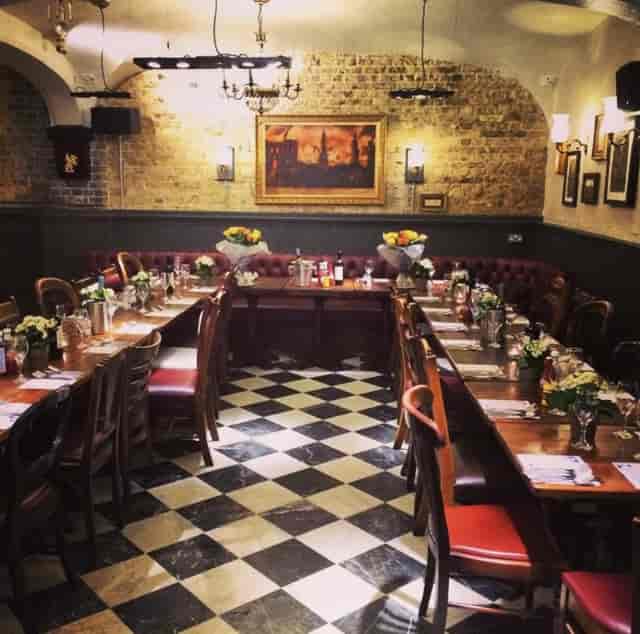 Martha's Cellar Bar dining space with floral centerpieces for events and gatherings.