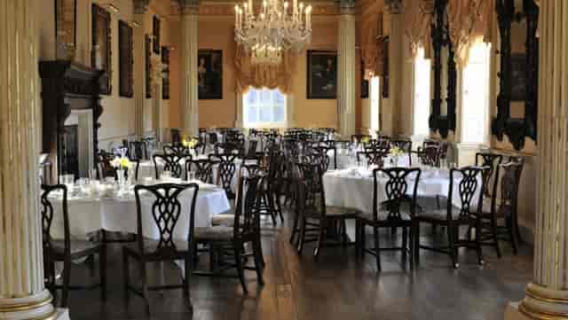 Elegant Long Gallery banquet hall with chandelier, perfect for formal events and receptions.