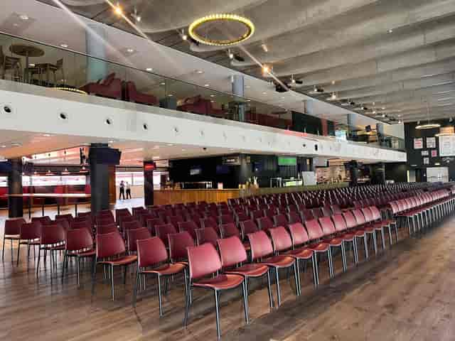 Royal Oak venue at Emirates Stadium with red chairs for meetings and events.