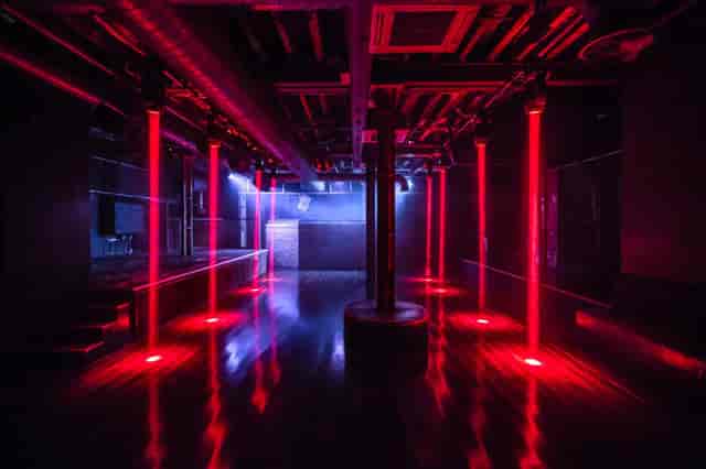 Sleek XOYO venue with red lighting, ideal for events and performances.
