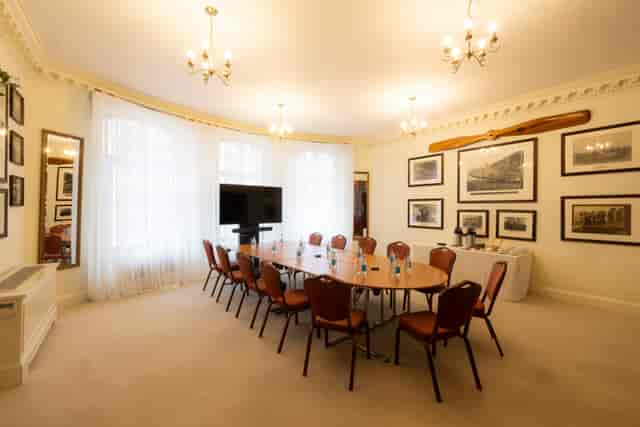 Sopwith Room meeting space with oval table, ideal for professional gatherings and presentations.