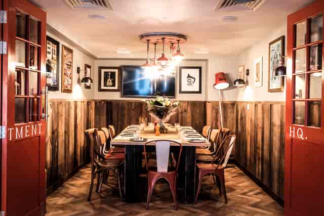 Intimate meeting space at The Hydrant with rustic decor for executive gatherings.