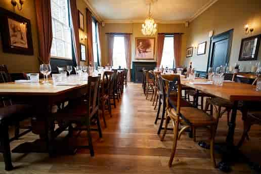 Romney Room dining space with elegant decor for intimate gatherings and corporate events.