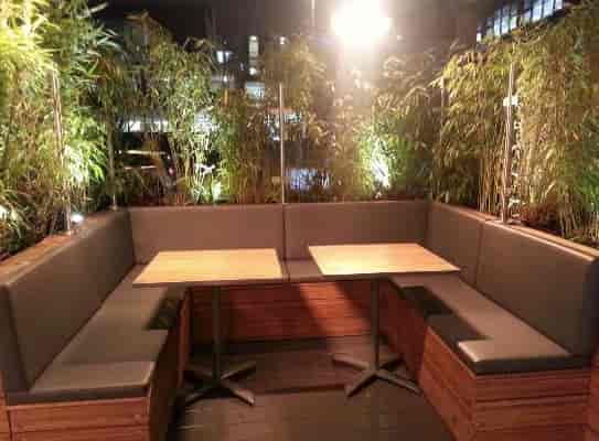 Cozy semi-private seating area at Zouk Tea Bar & Grill for networking events.