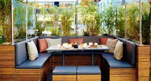 Stylish outdoor seating at Zouk Tea Bar & Grill, perfect for intimate gatherings and events.