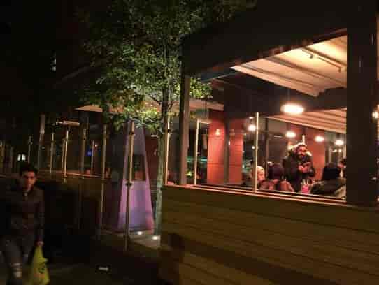 Vibrant outdoor dining at Zouk Tea Bar & Grill, perfect for networking events and gatherings.