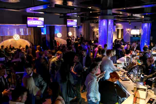 Vega Lounge networking event in Manchester 235, vibrant crowd and modern decor.