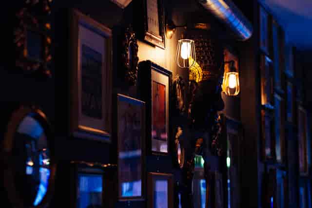 Stylish lounge bar wall with eclectic art, ideal for intimate gatherings and networking events.