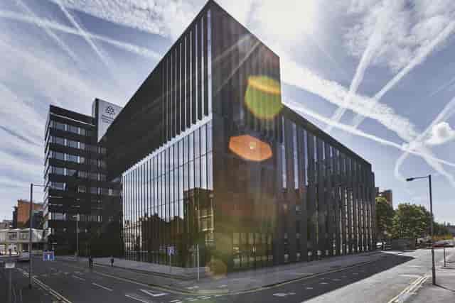 Modern Benzie Building meeting space with glass facade, ideal for corporate events and conferences.