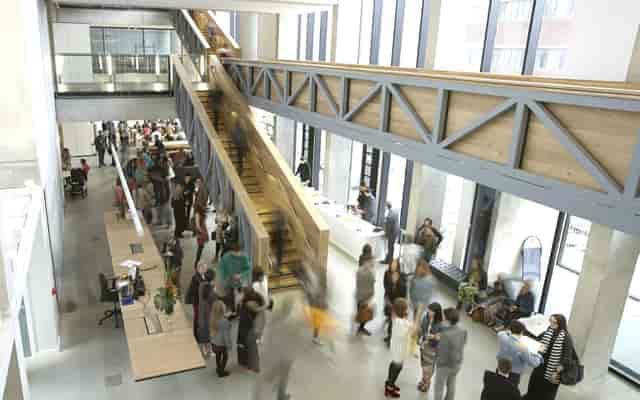 Modern meeting space in Benzie Building with large windows, ideal for events and networking.
