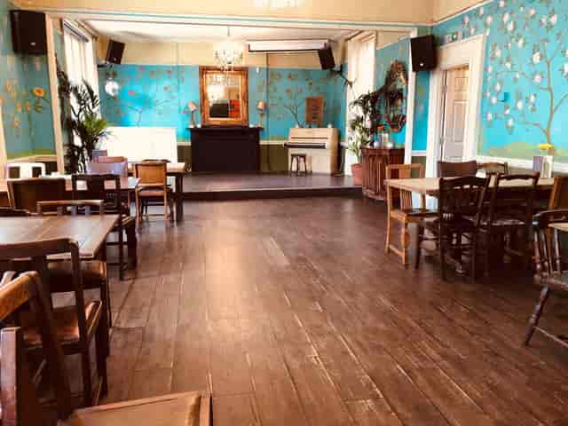 The Colonel Fawcett rustic pub venue featuring a raised stage for private events and parties.