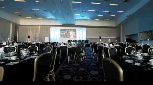 Banqueting suite at Edgbaston Stadium with LED lighting, perfect for gala dinners and events.