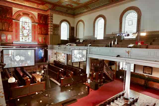 Main Church in St John's Hoxton, featuring stained glass windows, ideal for events and conferences.