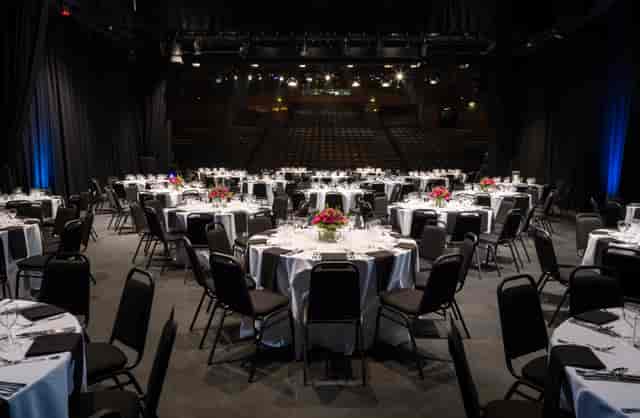 Elegant event space in The Mermaid London with floral centerpieces for networking.