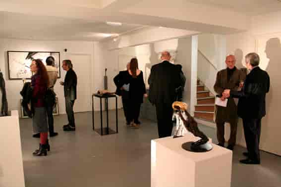 Sophisticated art gallery for networking events with elegant sculptures and artwork.