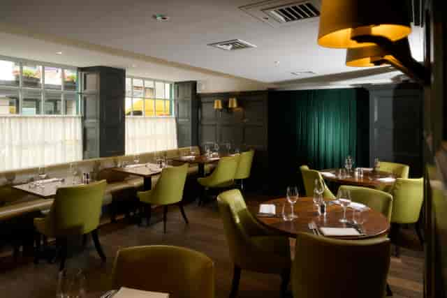 Sophisticated dining venue with plush seating for intimate meetings and events.