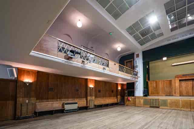 Spacious Conway Hall Main Hall with wooden floor, ideal for meetings and events.