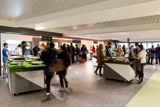 Courtyard at Guild of Students Liverpool, bustling event space with food stations for networking.