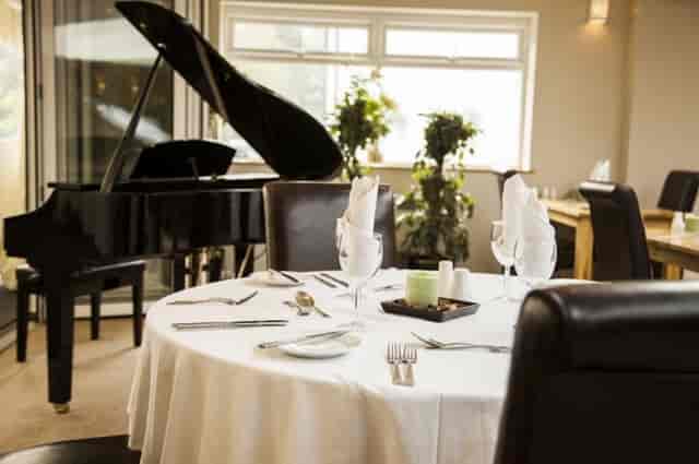 Elegant dining table in Orchard Suite, The Limes Lodge, perfect for upscale events.