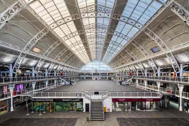 Spacious Mezzanine venue with high ceilings for trade shows and networking events.