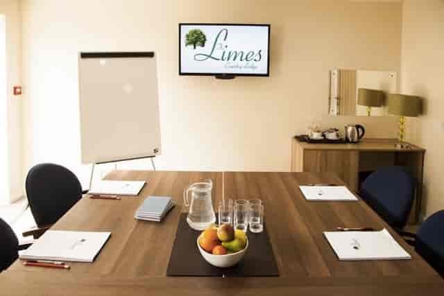 Syndicate Meeting Room at The Limes Lodge, featuring a polished table for corporate events.